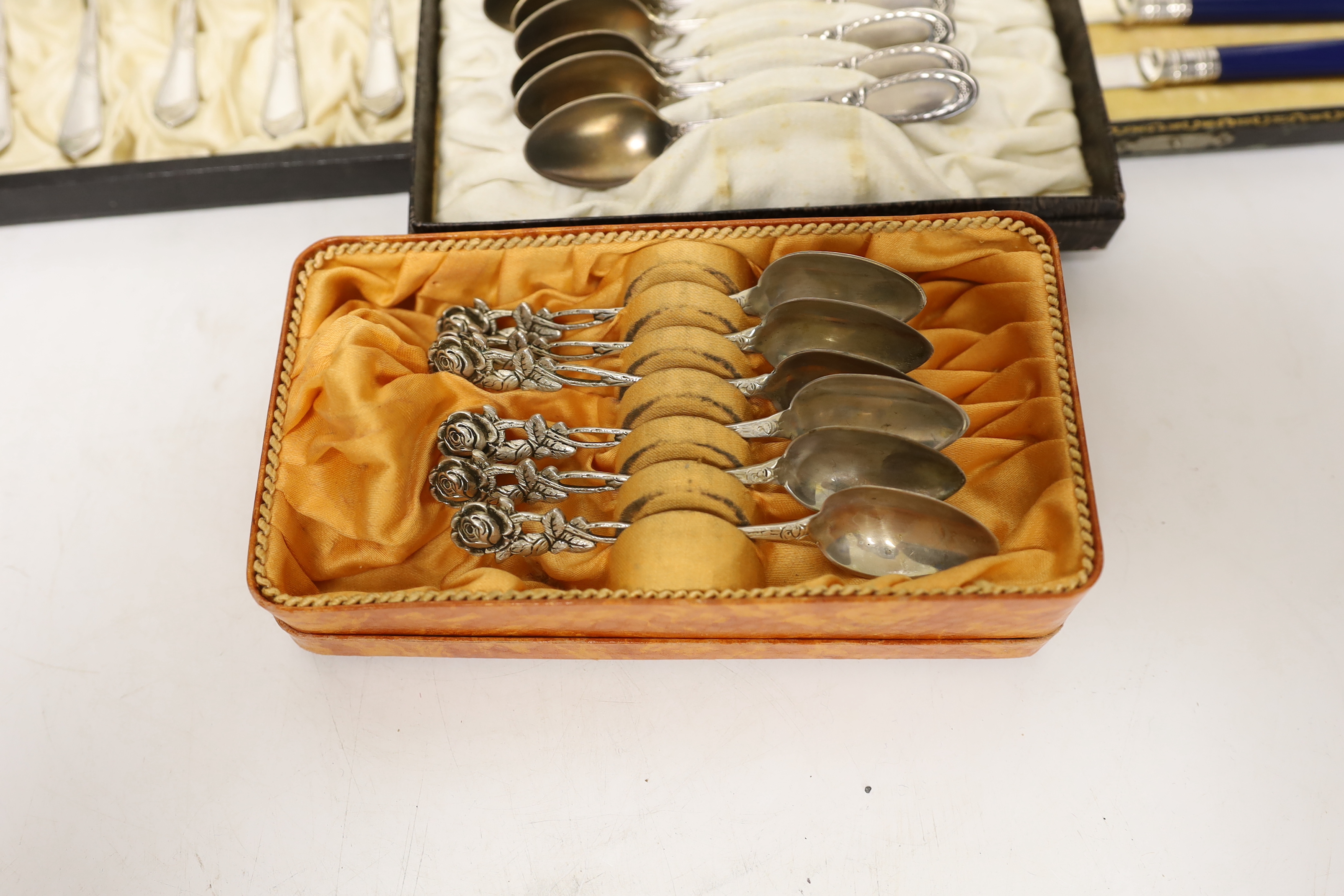 Four cased Continental cutlery sets, one 800 standard